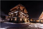 Chalet Haut de cry by Swiss alps village