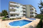 Seaside apartments with a swimming pool Okrug Gornji