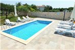 Apartments and rooms with a swimming pool Babici
