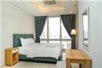 Cozy 2BR @ The Masterpiece Condominium Epicentrum Apartment By Travelio