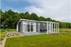 Chalet with a see-through fireplace near the Oosterschelde