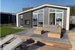 Modern chalet with jetty and terrace near the Oosterschelde