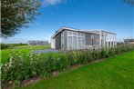 Modern chalet with a fireplace near the Oosterschelde