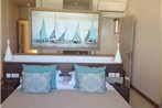 Coral Bay Beachfront Apartment by Vacanzy Collection