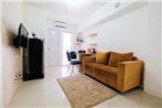 Cozy 2BR Bassura City Apartment with City View By Travelio