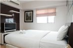 Strategic Location 1BR The Wave Apartment with City View By Travelio