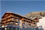 Snow covered elevated homes on the border of Salzburgerland